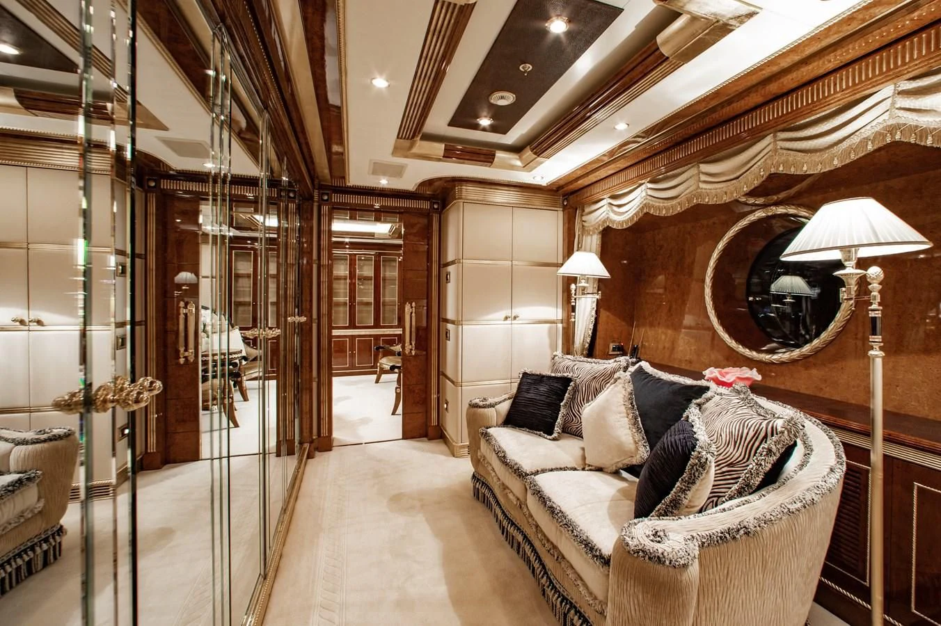 a room with a couch and a mirror aboard SORRENTO Yacht for Sale