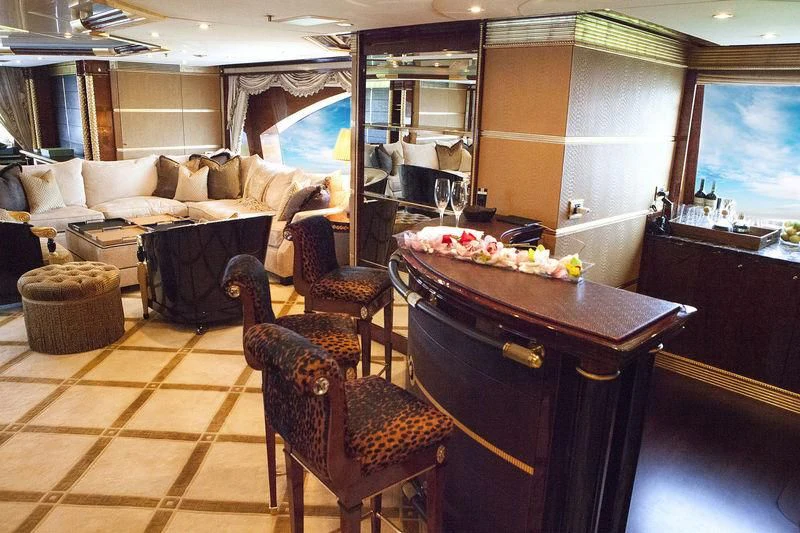 a living room with a table and chairs aboard SORRENTO Yacht for Sale