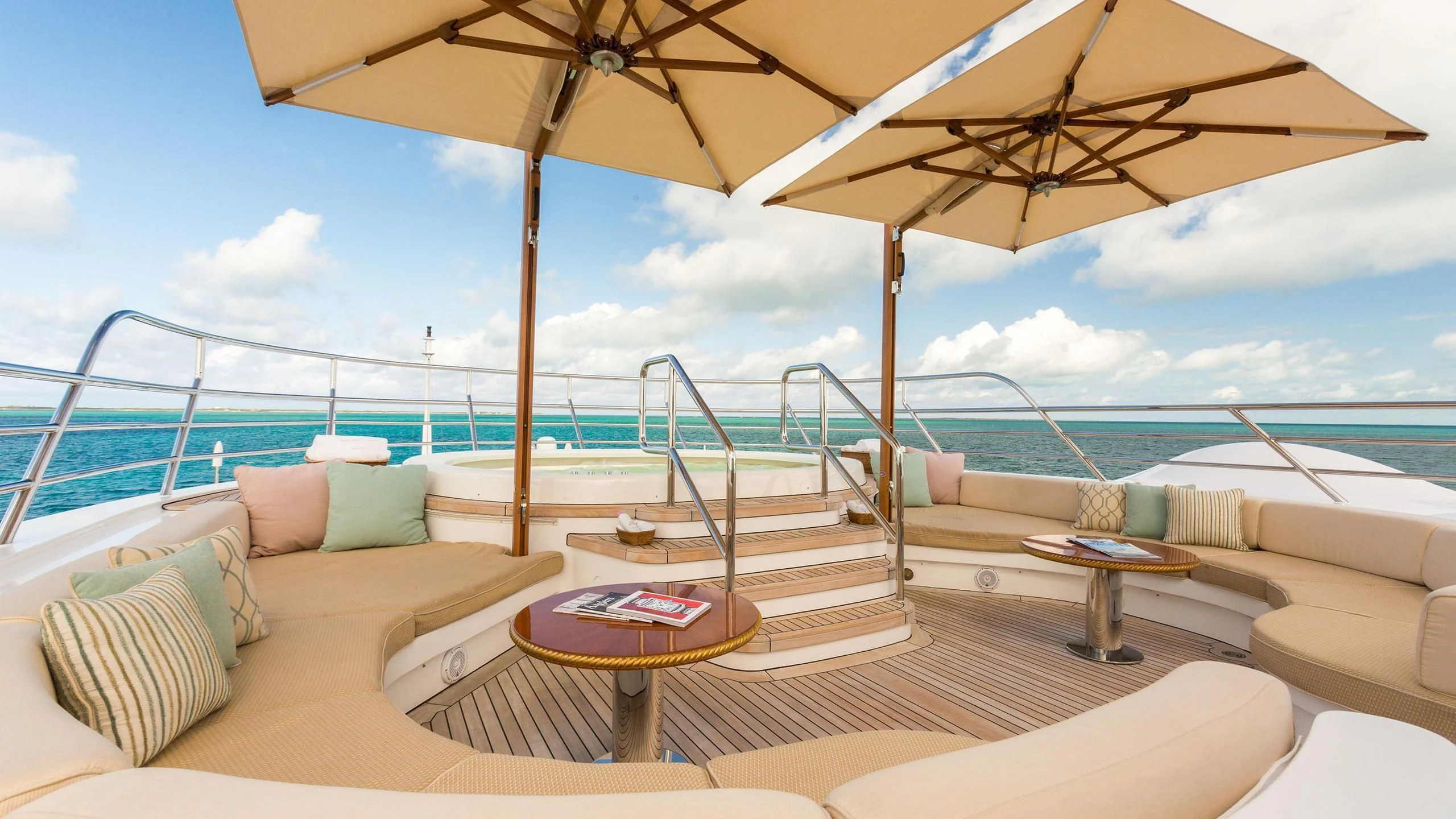 a lounge area with a large umbrella aboard SORRENTO Yacht for Sale