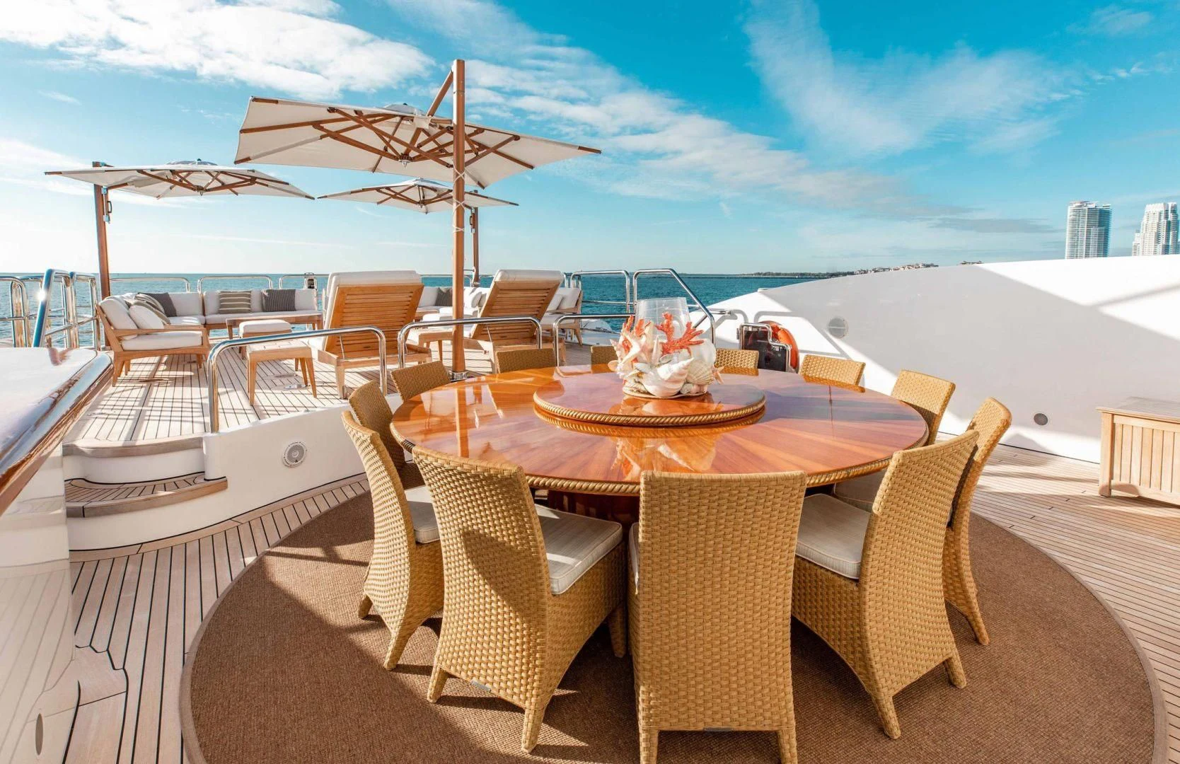 a table with chairs and umbrellas on it aboard SORRENTO Yacht for Sale