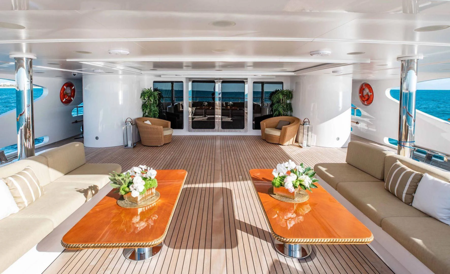 a living room with a table and couches aboard SORRENTO Yacht for Sale