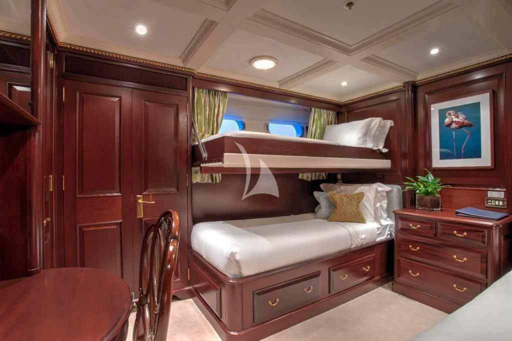 a bed in a room aboard TELEOST Yacht for Sale