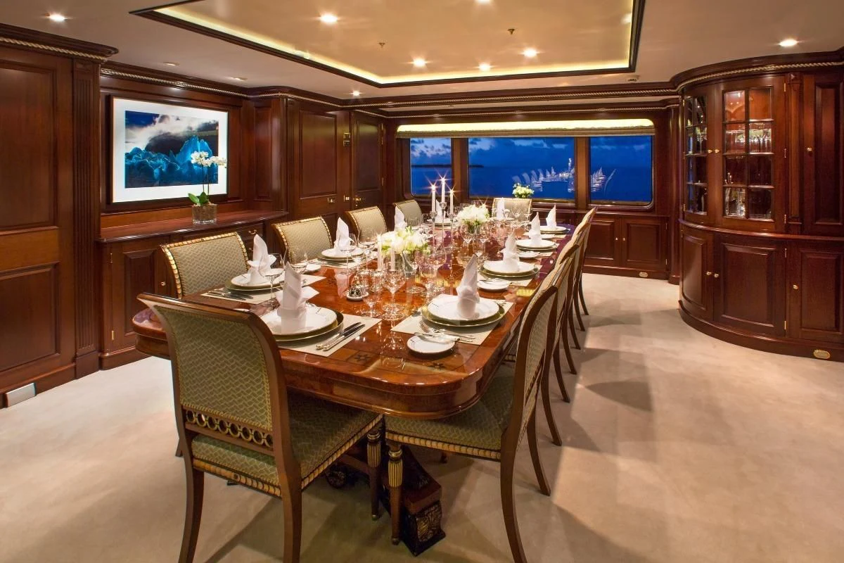 a dining room with a table set aboard TELEOST Yacht for Sale