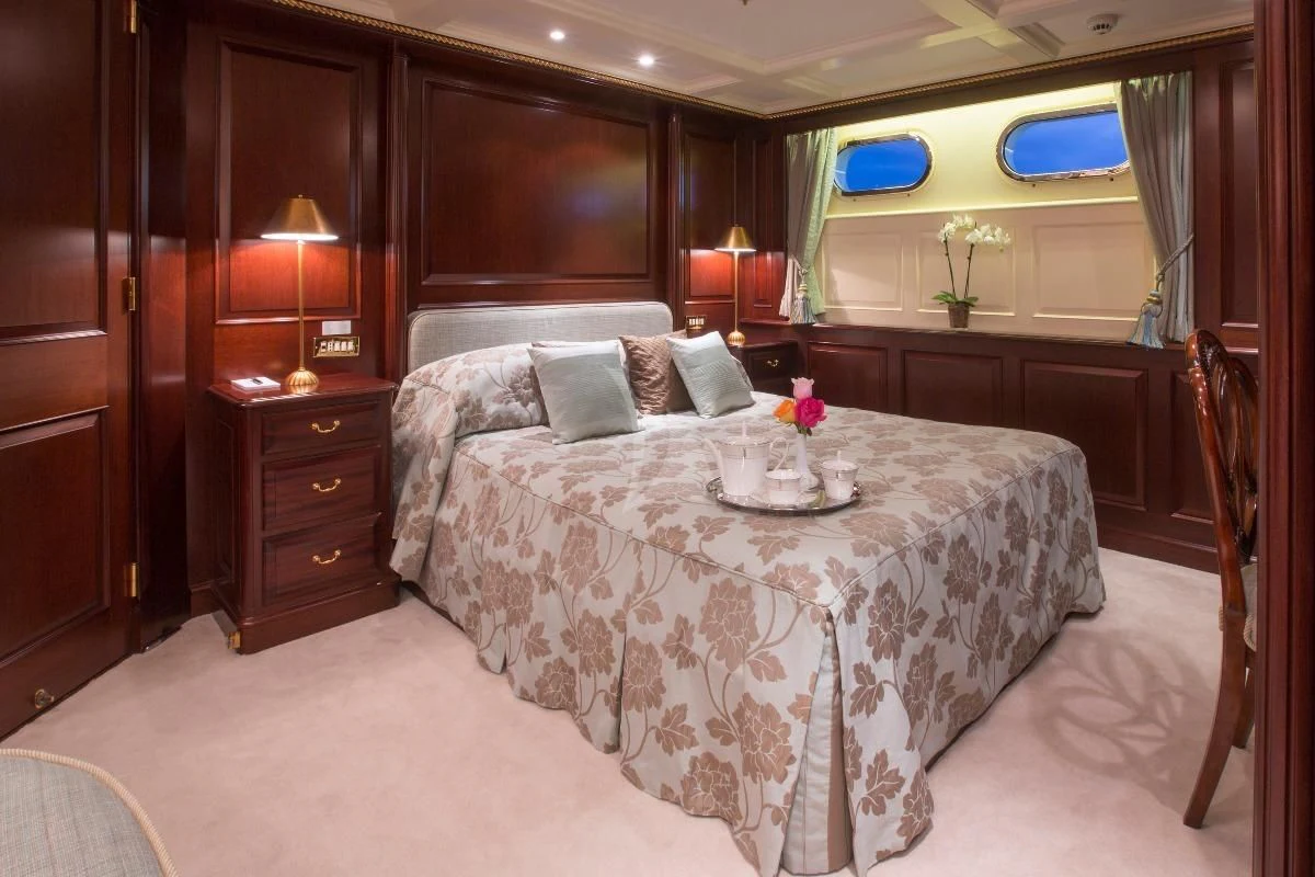 a large bed in a room aboard TELEOST Yacht for Sale
