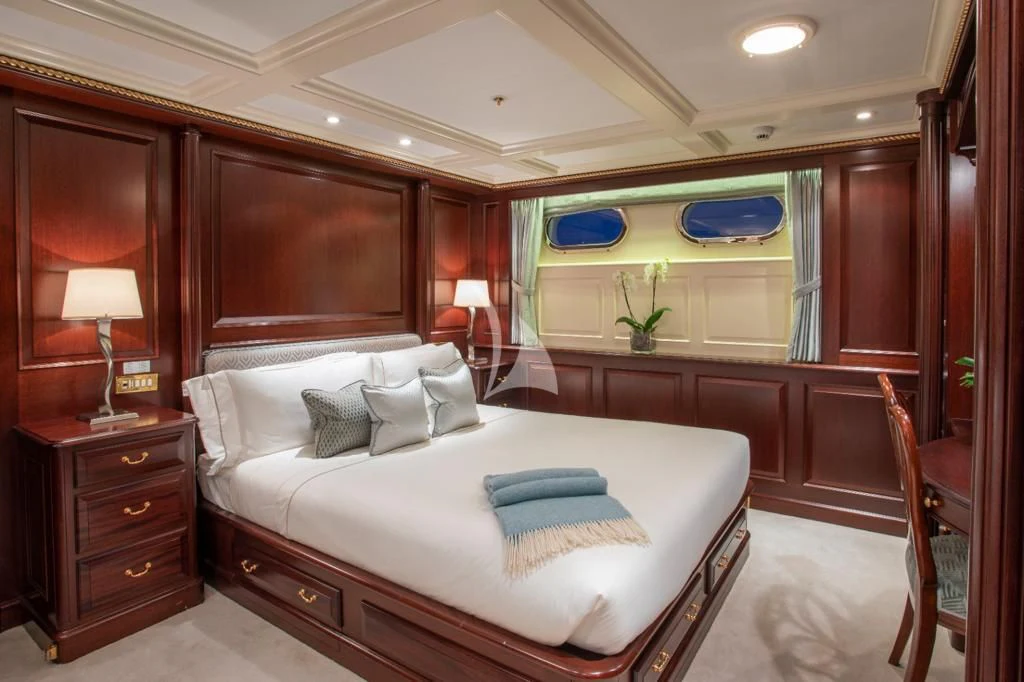 a large bed in a room aboard TELEOST Yacht for Sale
