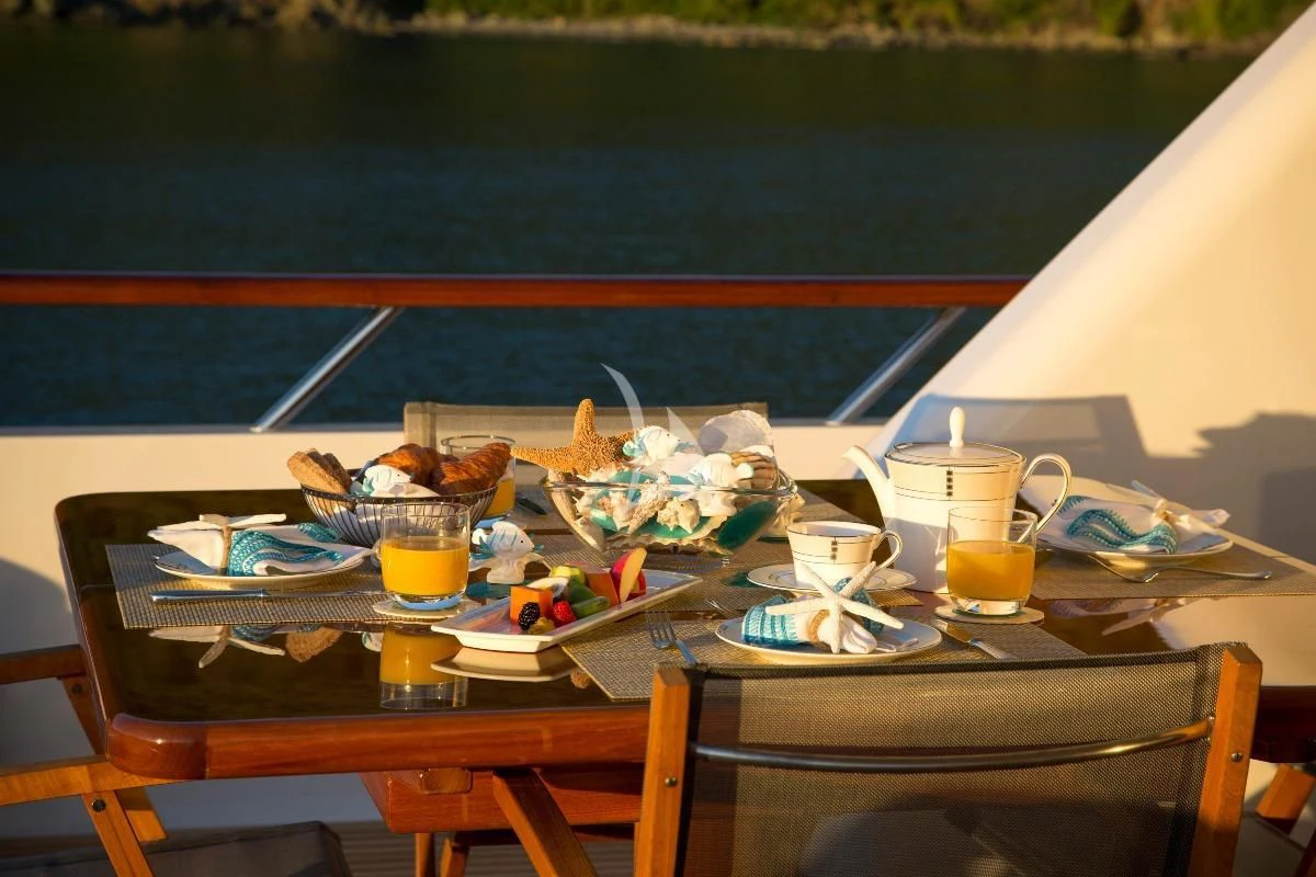 a table with food on it aboard TELEOST Yacht for Sale