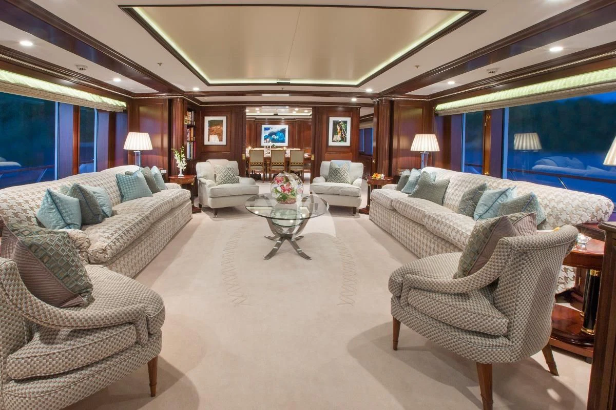 a living room with a large window aboard TELEOST Yacht for Sale