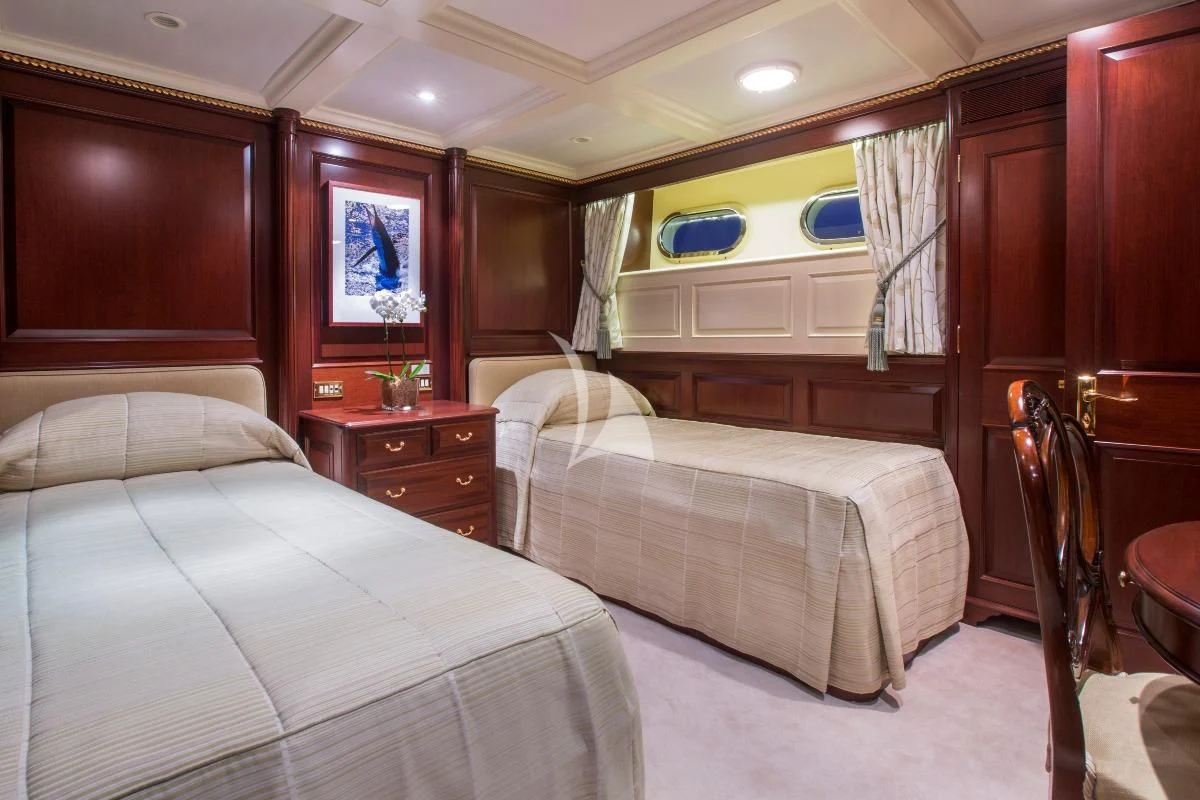 a room with two beds aboard TELEOST Yacht for Sale