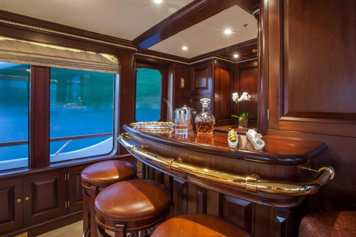 a bar with a table and chairs aboard TELEOST Yacht for Sale
