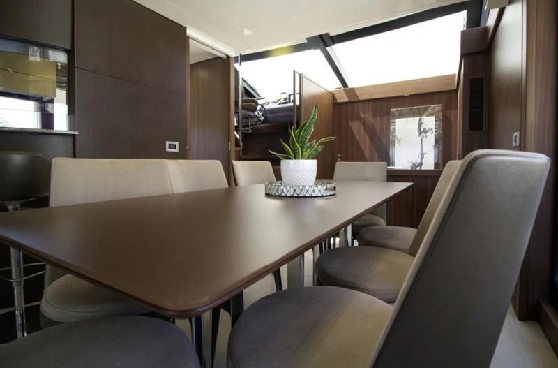 a table with chairs and a plant on it aboard SEDA Yacht for Sale