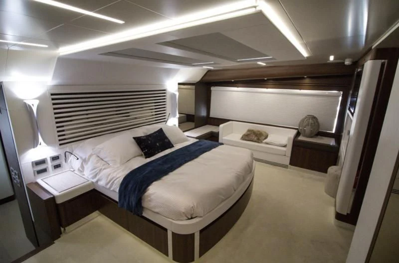 a room with a bed and a desk aboard SEDA Yacht for Sale
