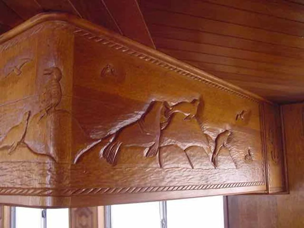 a wooden carving of a dragon aboard PRINCIPE DEL MAR Yacht for Sale