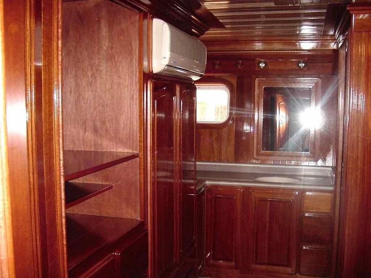 a room with wooden cabinets aboard PRINCIPE DEL MAR Yacht for Sale