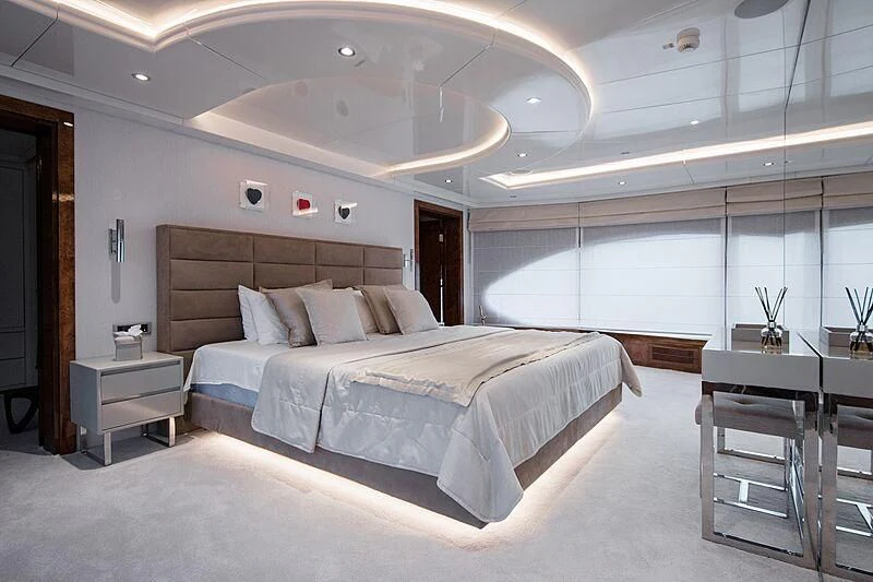a large bed in a room aboard HALLO Yacht for Sale
