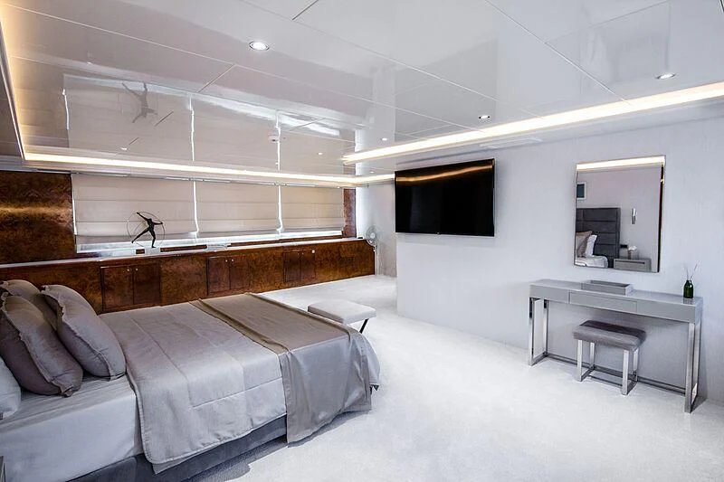a room with a bed and a desk aboard HALLO Yacht for Sale