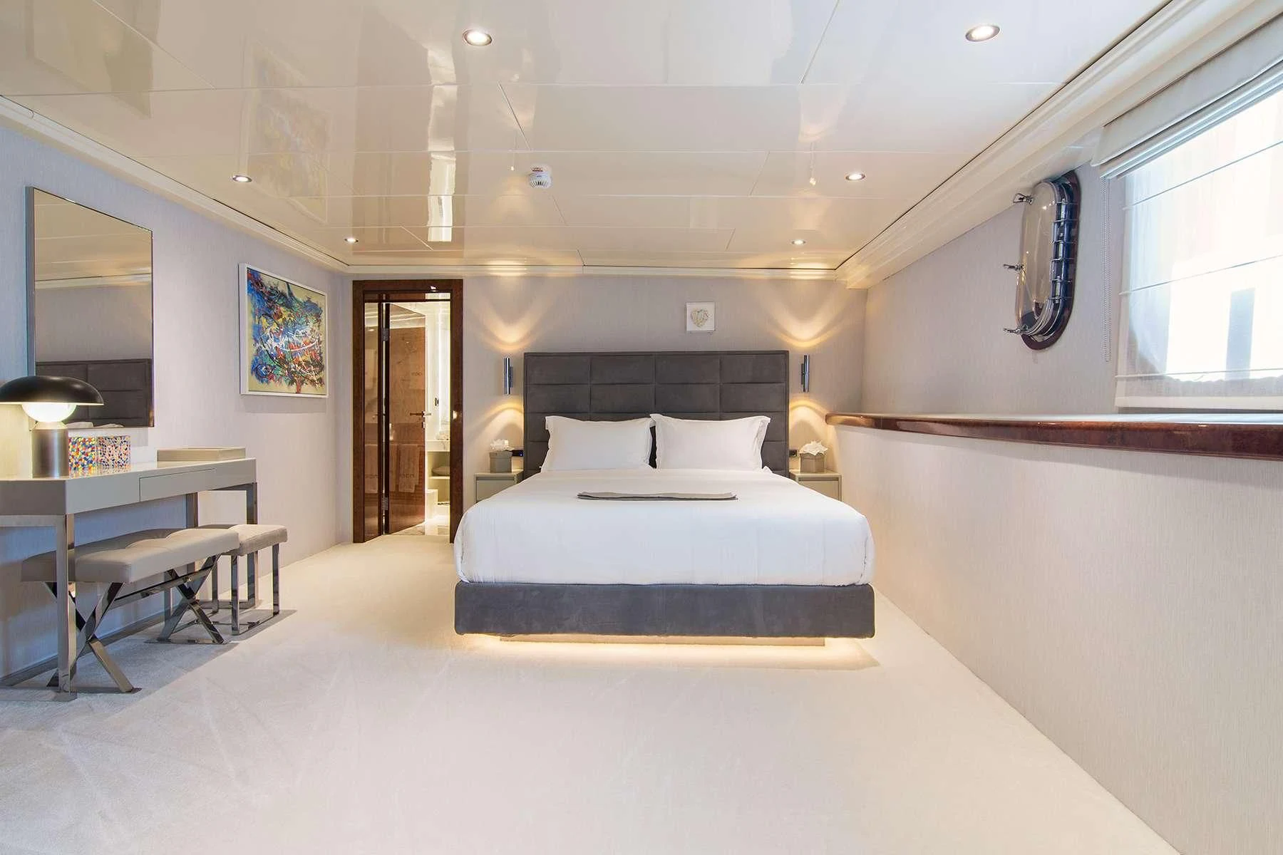 a room with a bed and a desk aboard HALLO Yacht for Sale