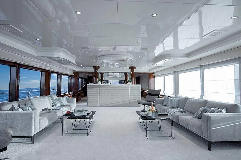 a living room with white furniture aboard HALLO Yacht for Sale