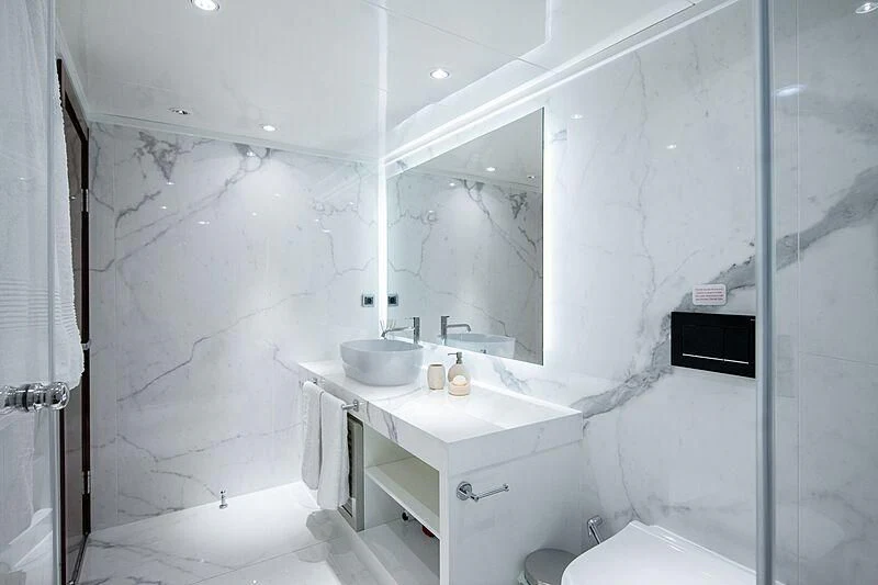 a bathroom with a sink and a mirror aboard HALLO Yacht for Sale