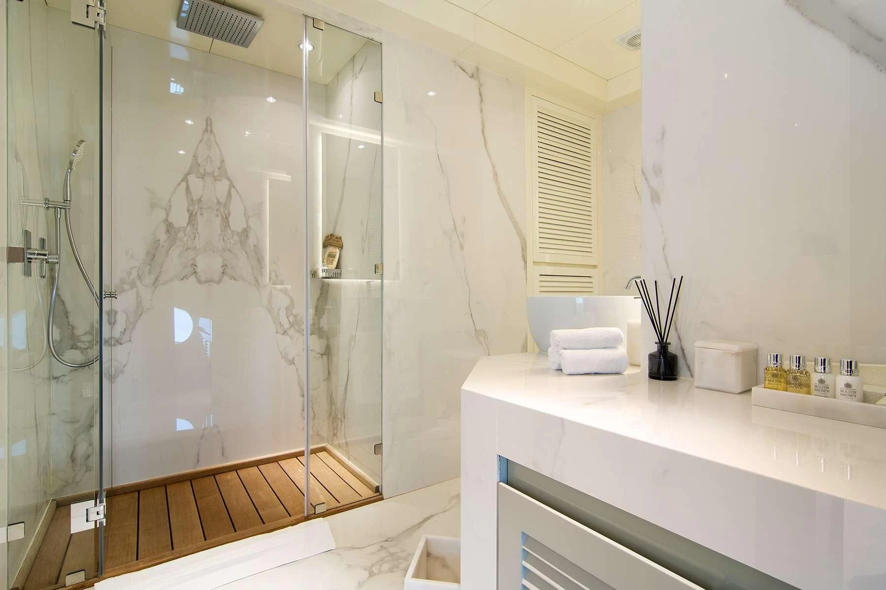 a bathroom with a glass shower aboard HALLO Yacht for Sale