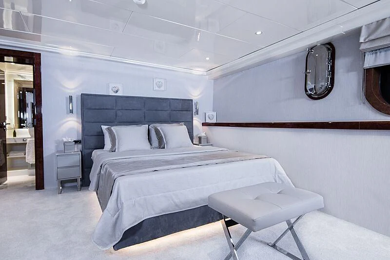 a bed in a room aboard HALLO Yacht for Sale