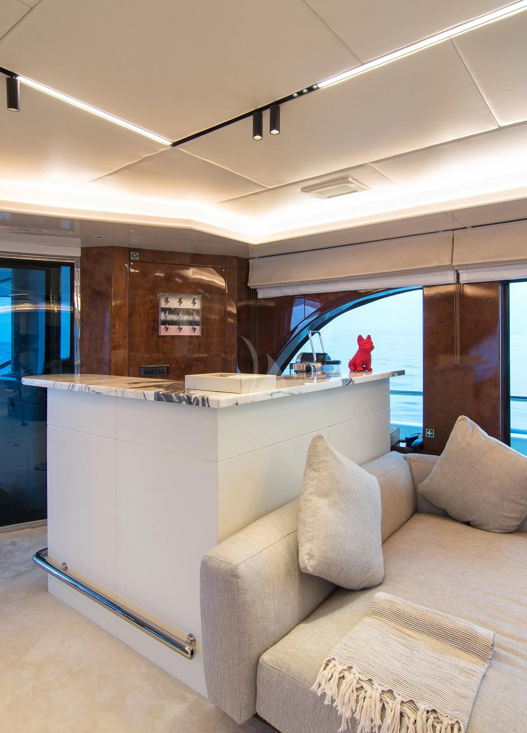 a room with a couch and a window aboard HALLO Yacht for Sale