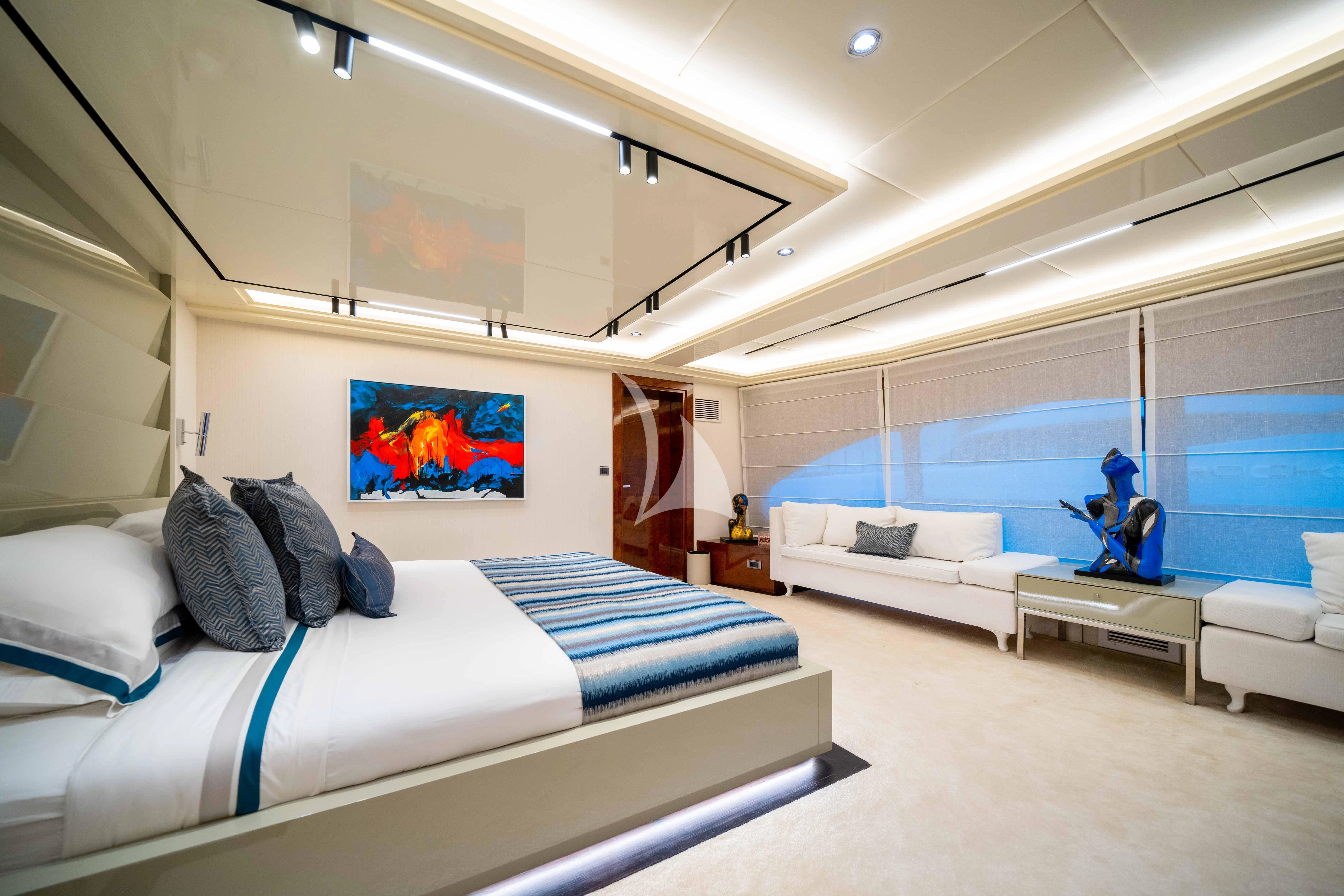 a room with a bed and a desk aboard HALLO Yacht for Sale