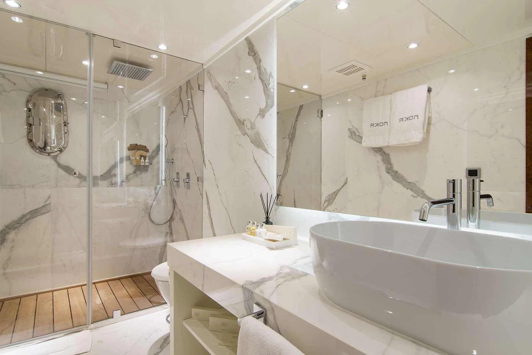 a bathroom with a large mirror aboard HALLO Yacht for Sale