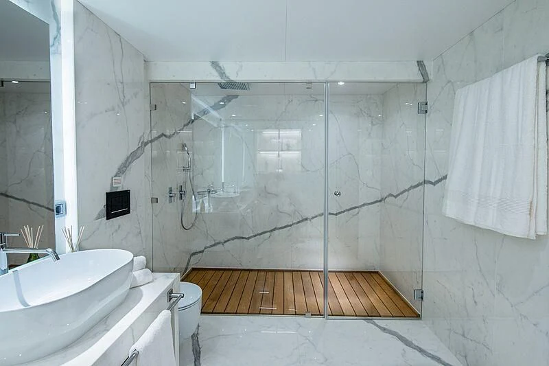 a bathroom with a shower and sink aboard HALLO Yacht for Sale