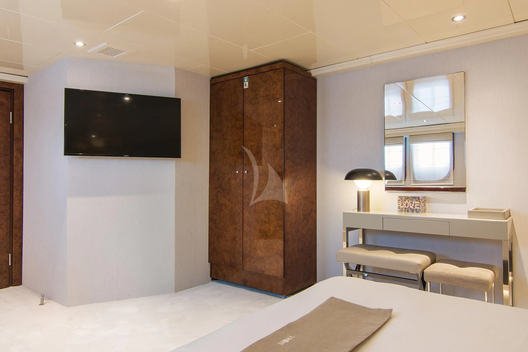 a room with a bed and a tv on the wall aboard HALLO Yacht for Sale