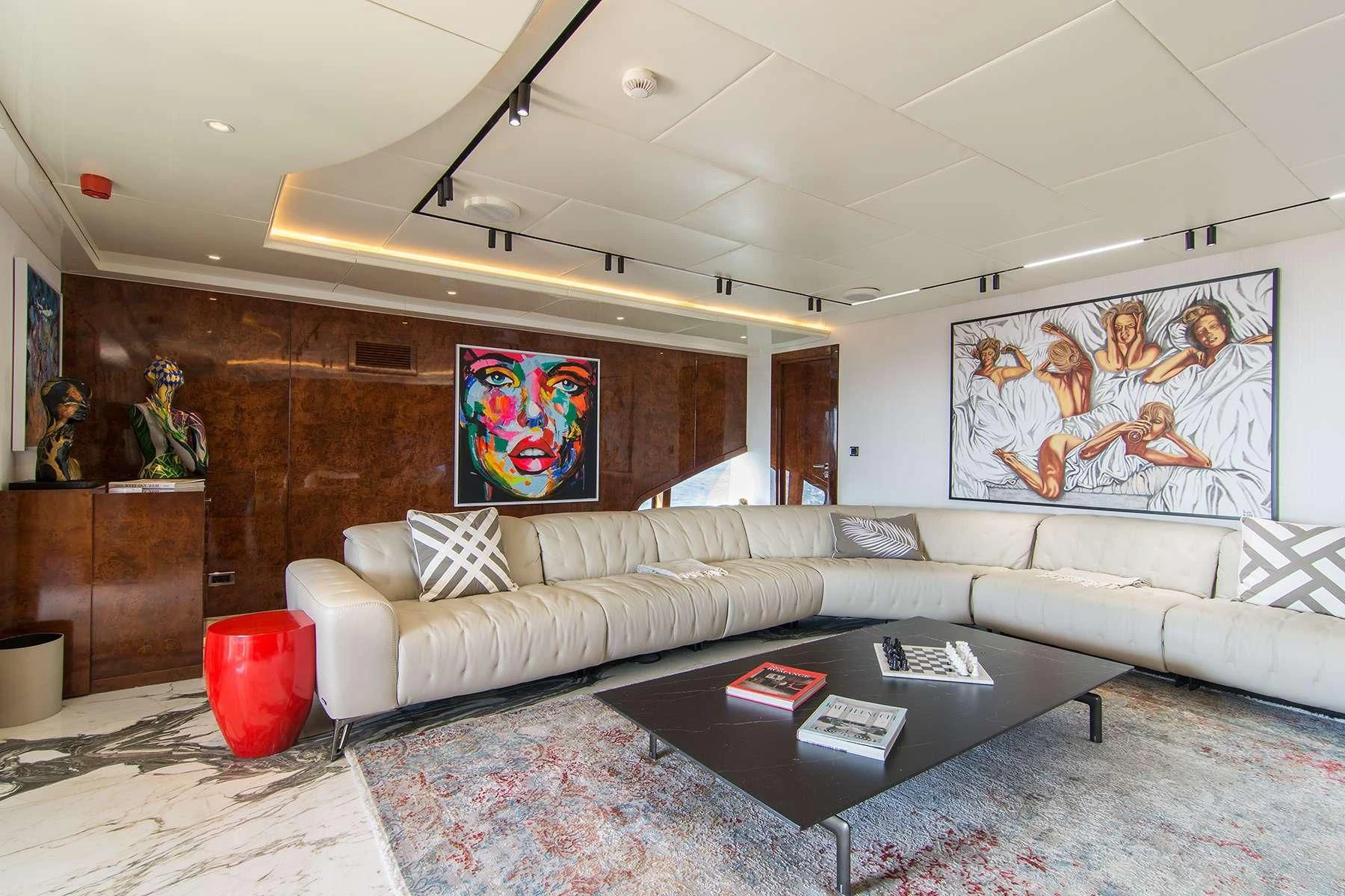 a living room with a large painting aboard HALLO Yacht for Sale