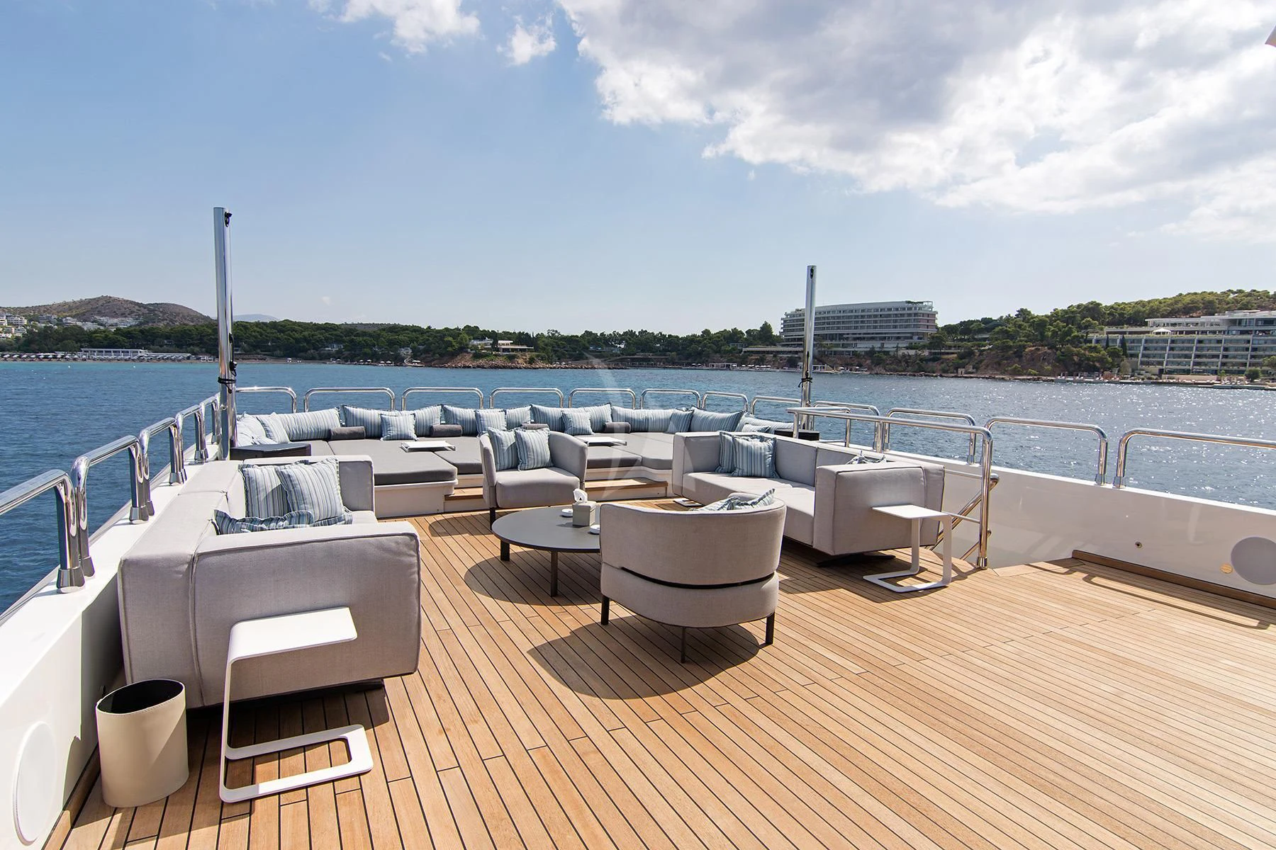 a deck with chairs and tables on it aboard HALLO Yacht for Sale