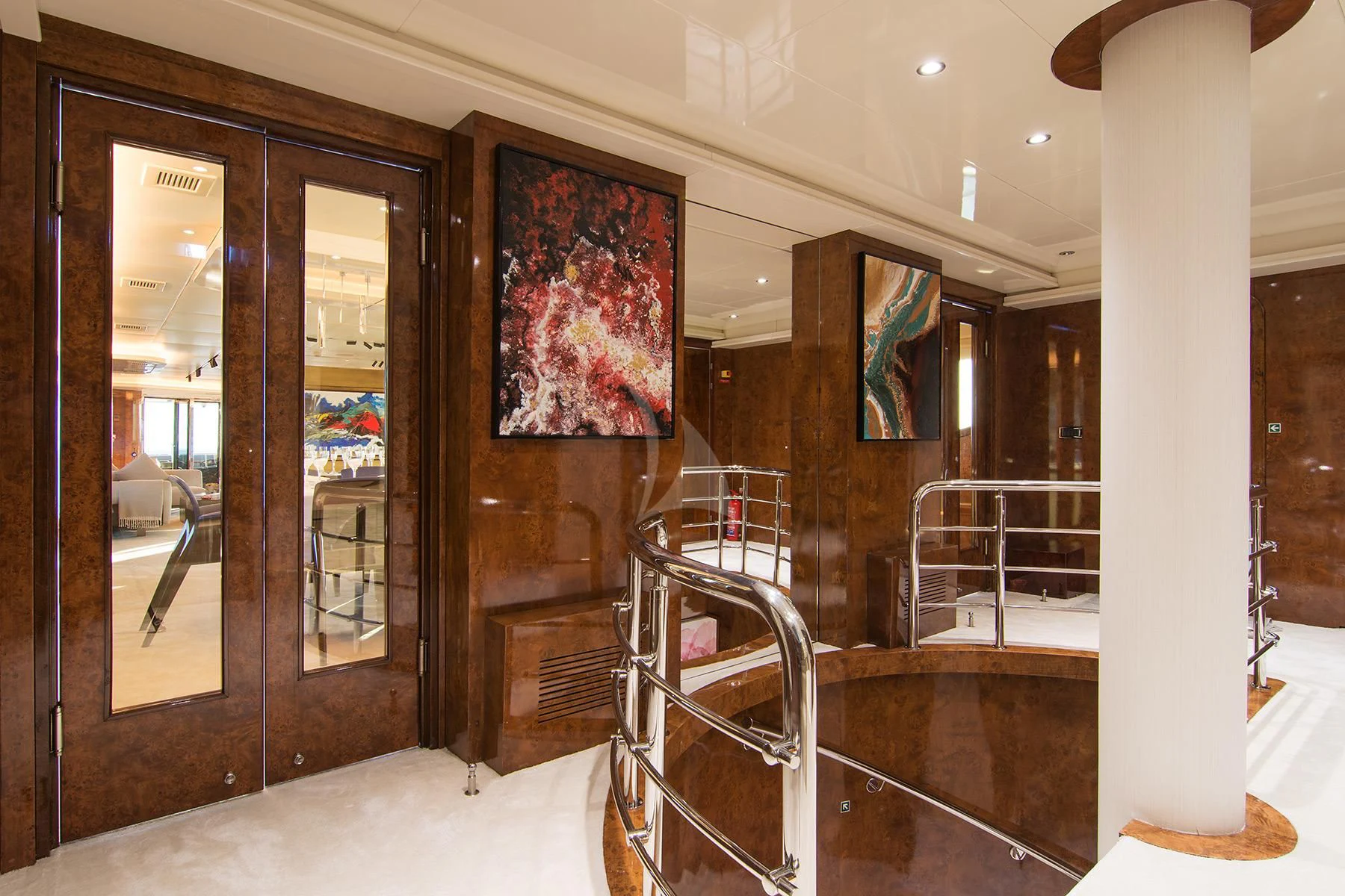 a room with a glass door and a painting on the wall aboard HALLO Yacht for Sale