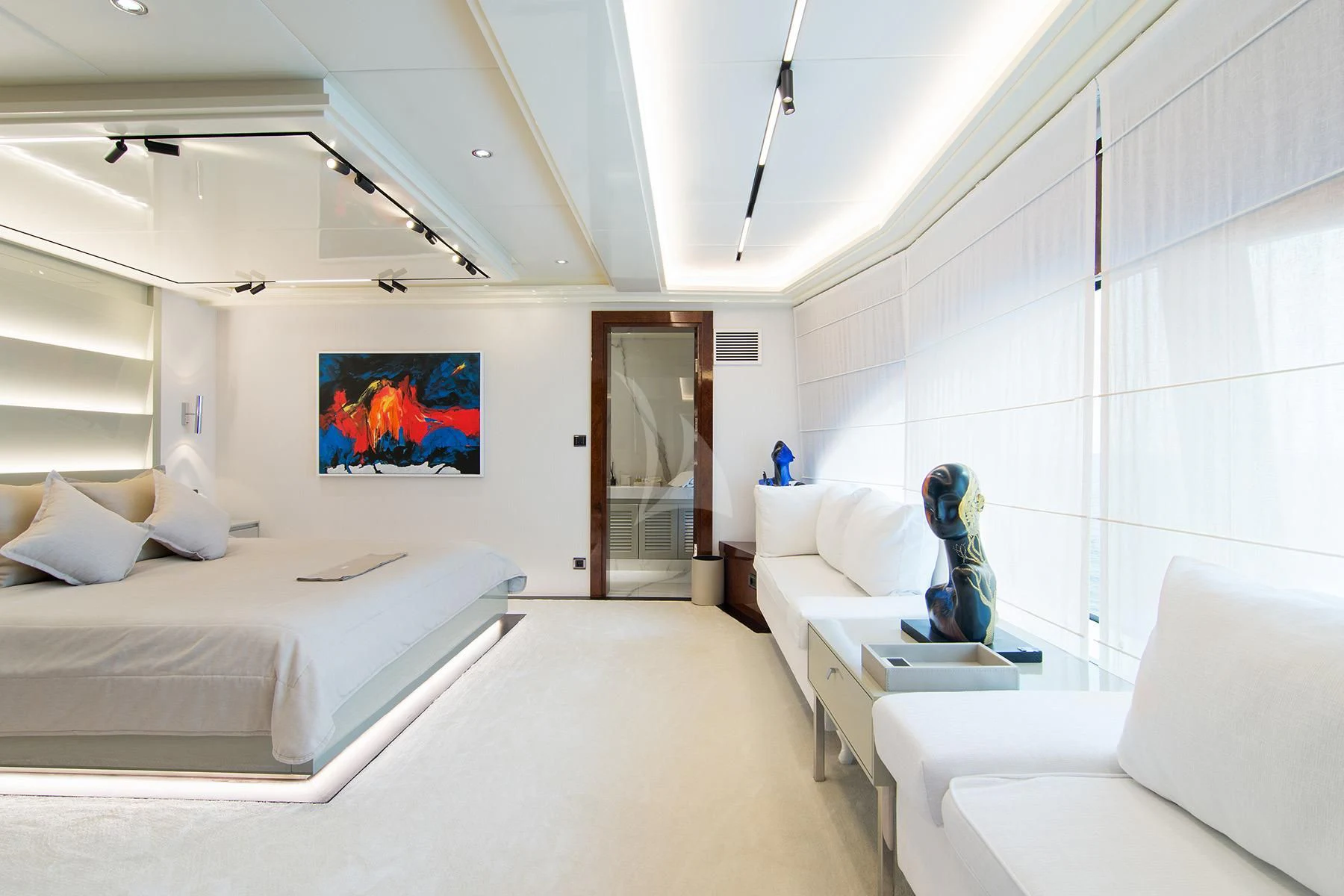 a room with a bed and a couch aboard HALLO Yacht for Sale