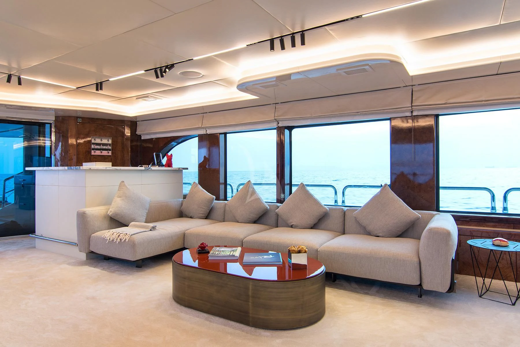 a living room with a couch and a table aboard HALLO Yacht for Sale