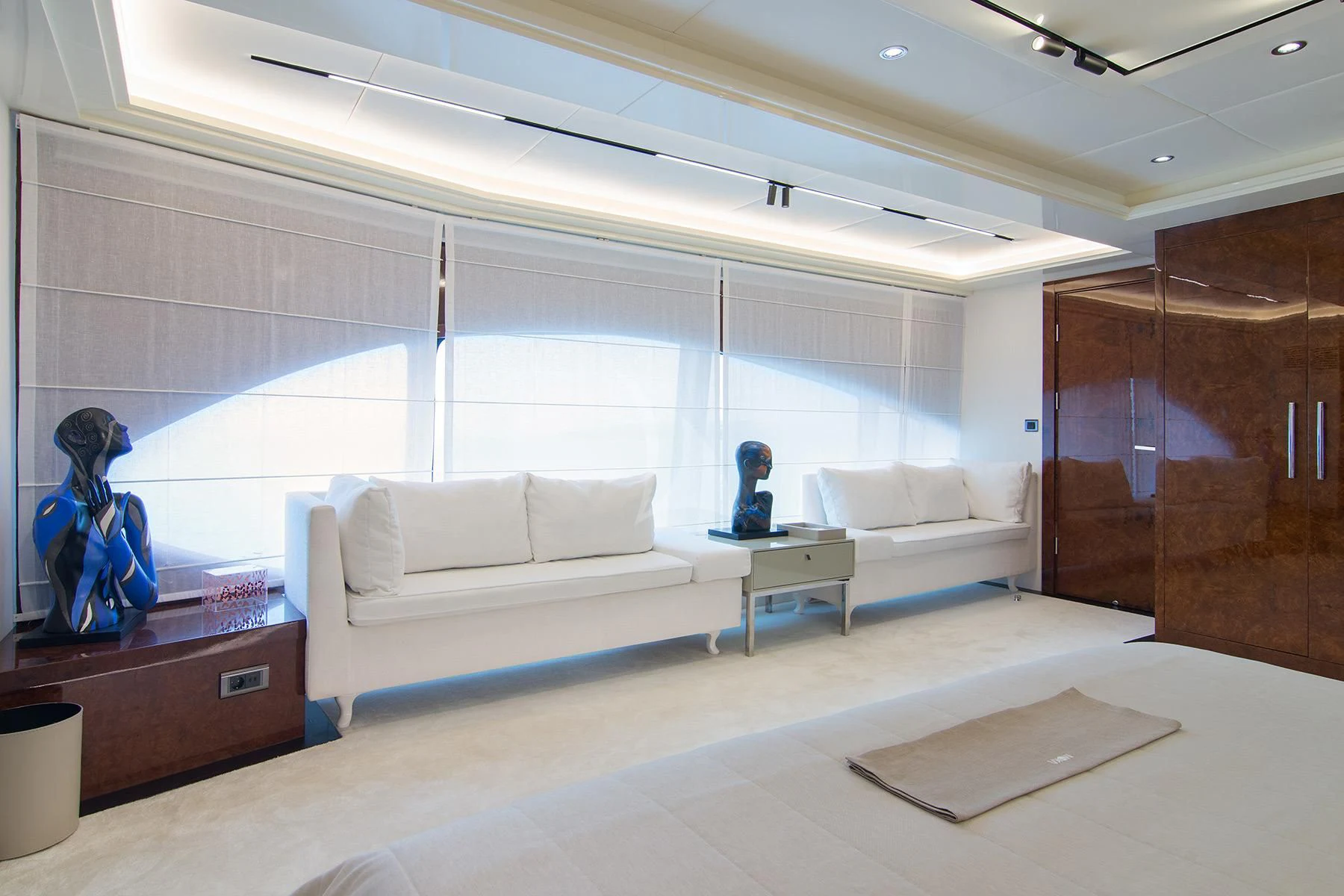 a room with a couch and a desk aboard HALLO Yacht for Sale