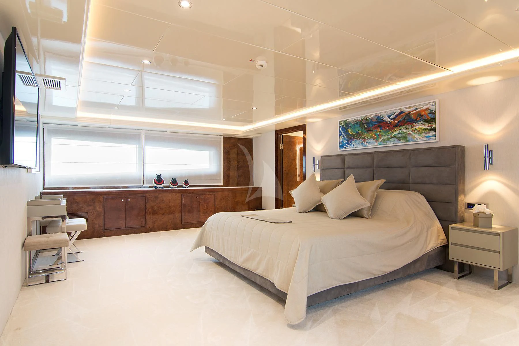 a large bedroom with a large bed aboard HALLO Yacht for Sale