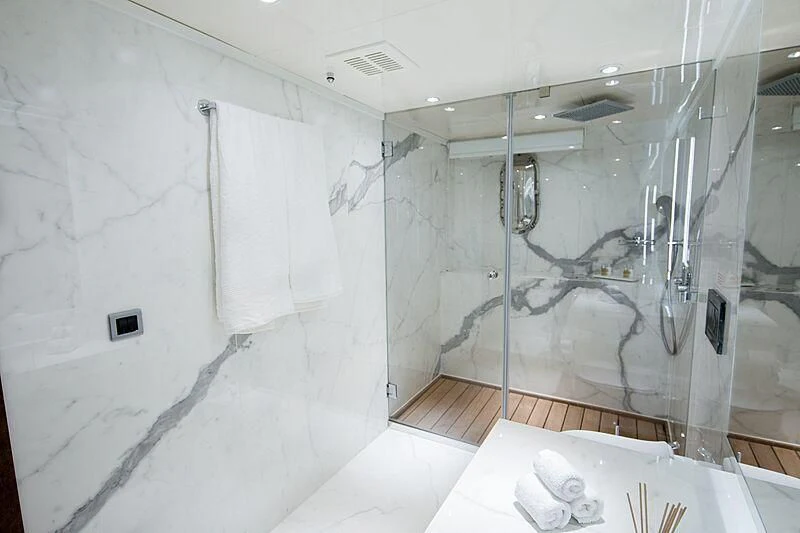 a bathroom with a glass shower aboard HALLO Yacht for Sale
