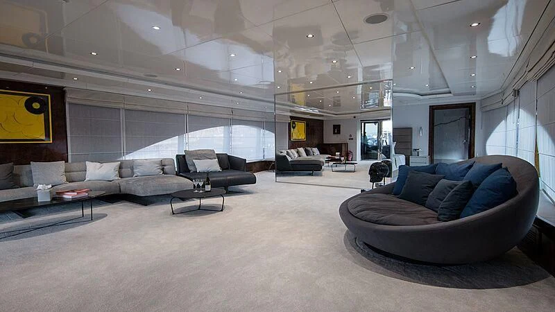 a large living room with a large window aboard HALLO Yacht for Sale