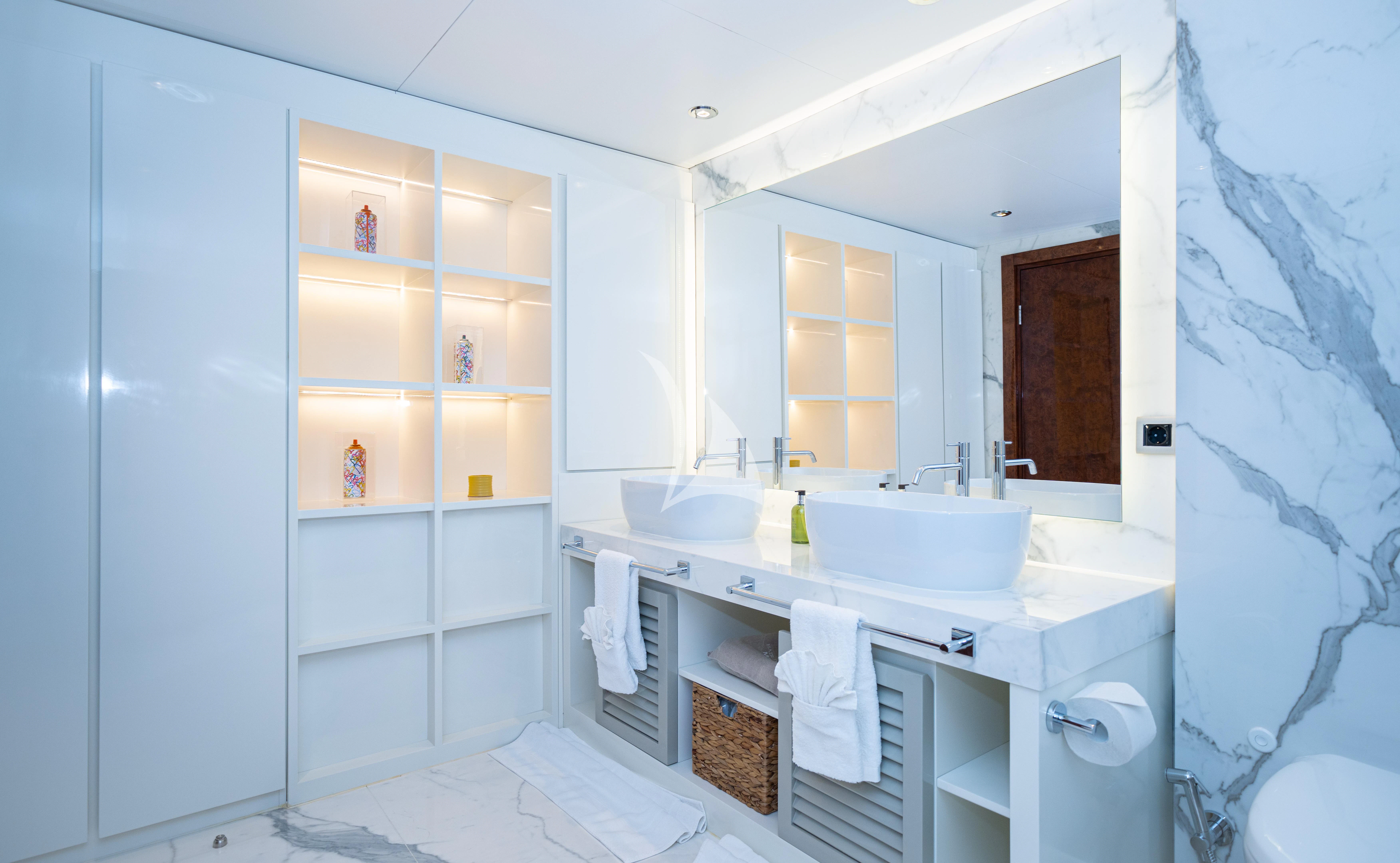 a bathroom with a sink and a mirror aboard HALLO Yacht for Sale