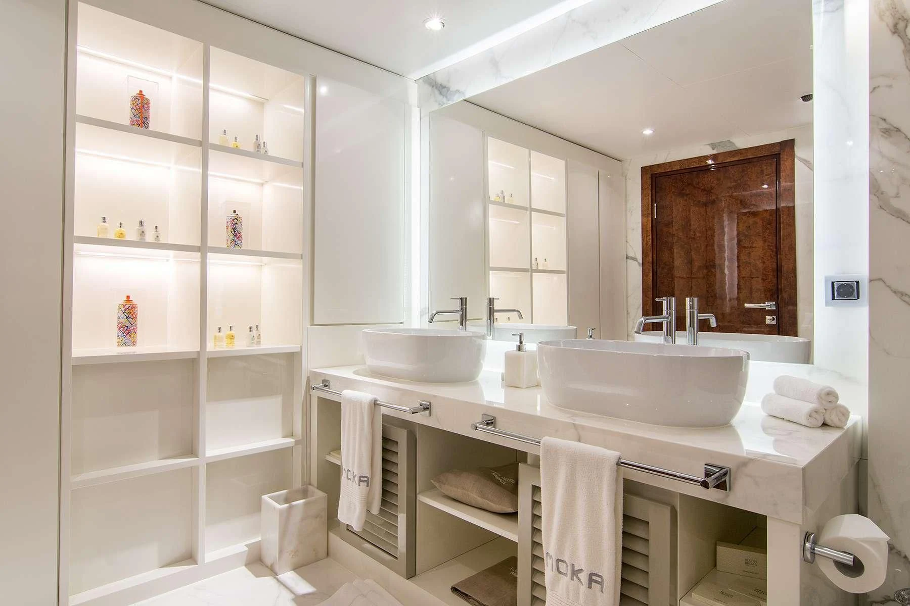 a bathroom with a sink and a mirror aboard HALLO Yacht for Sale