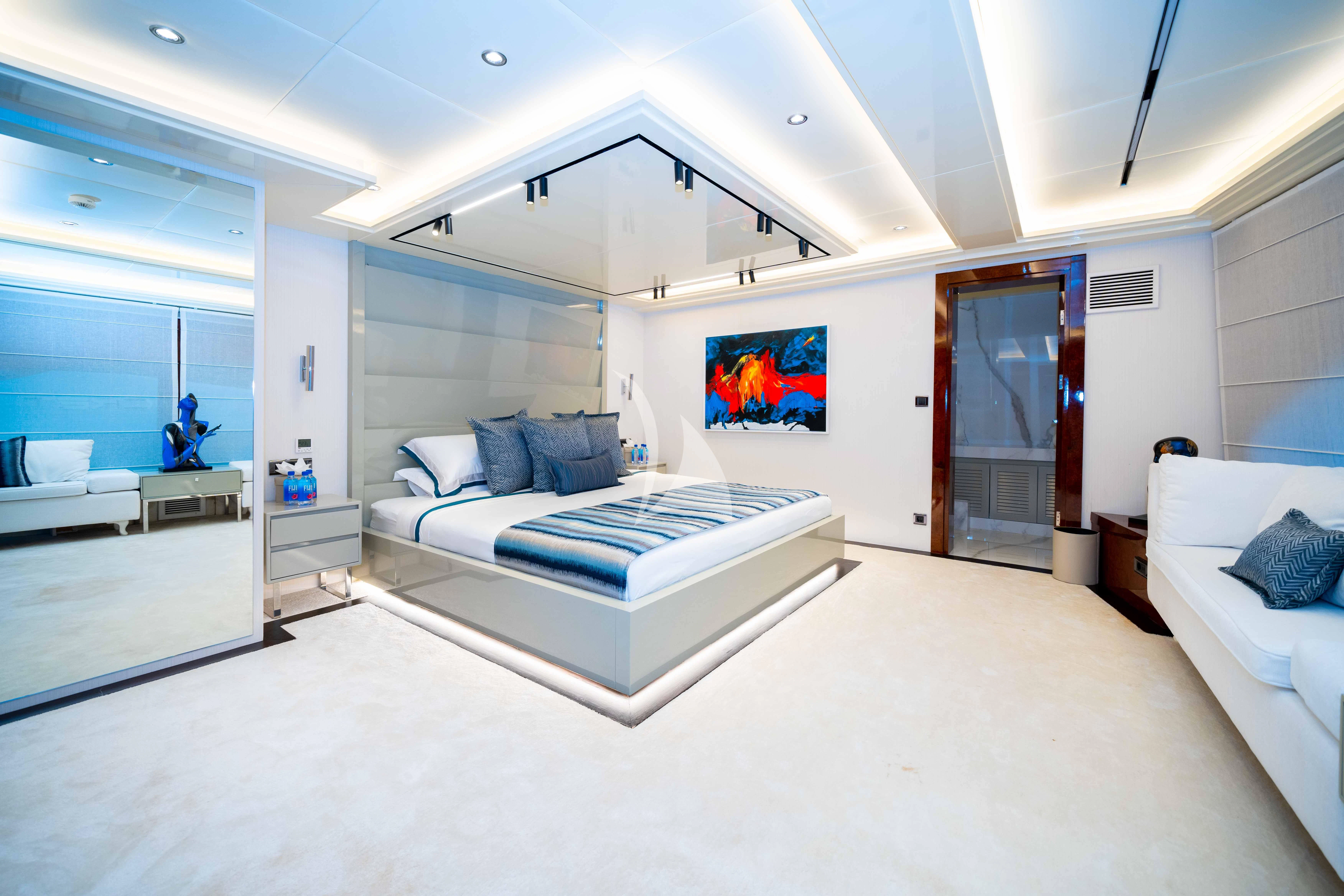 a room with a bed and a tv aboard HALLO Yacht for Sale