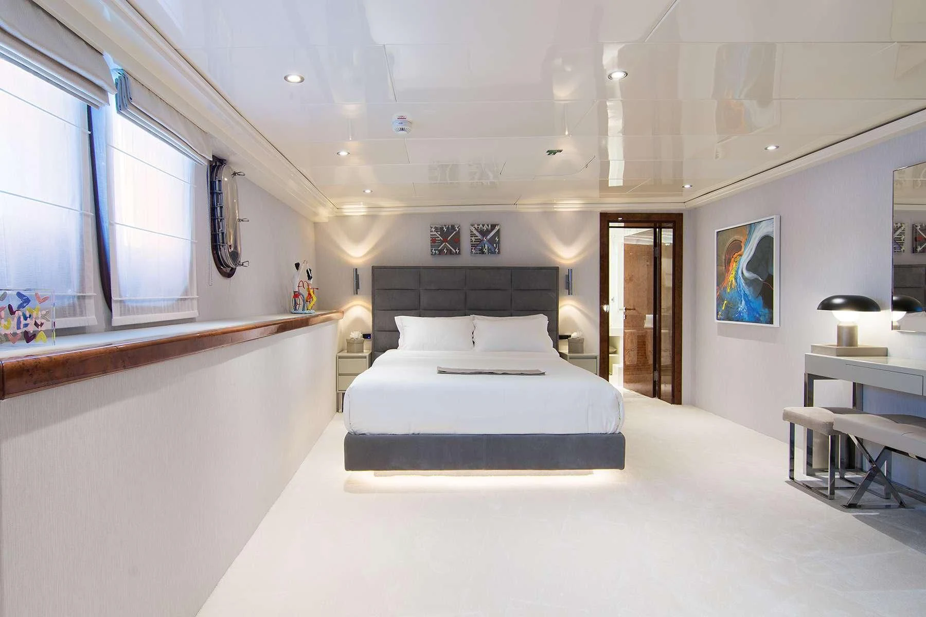 a room with a bed and a desk aboard HALLO Yacht for Sale