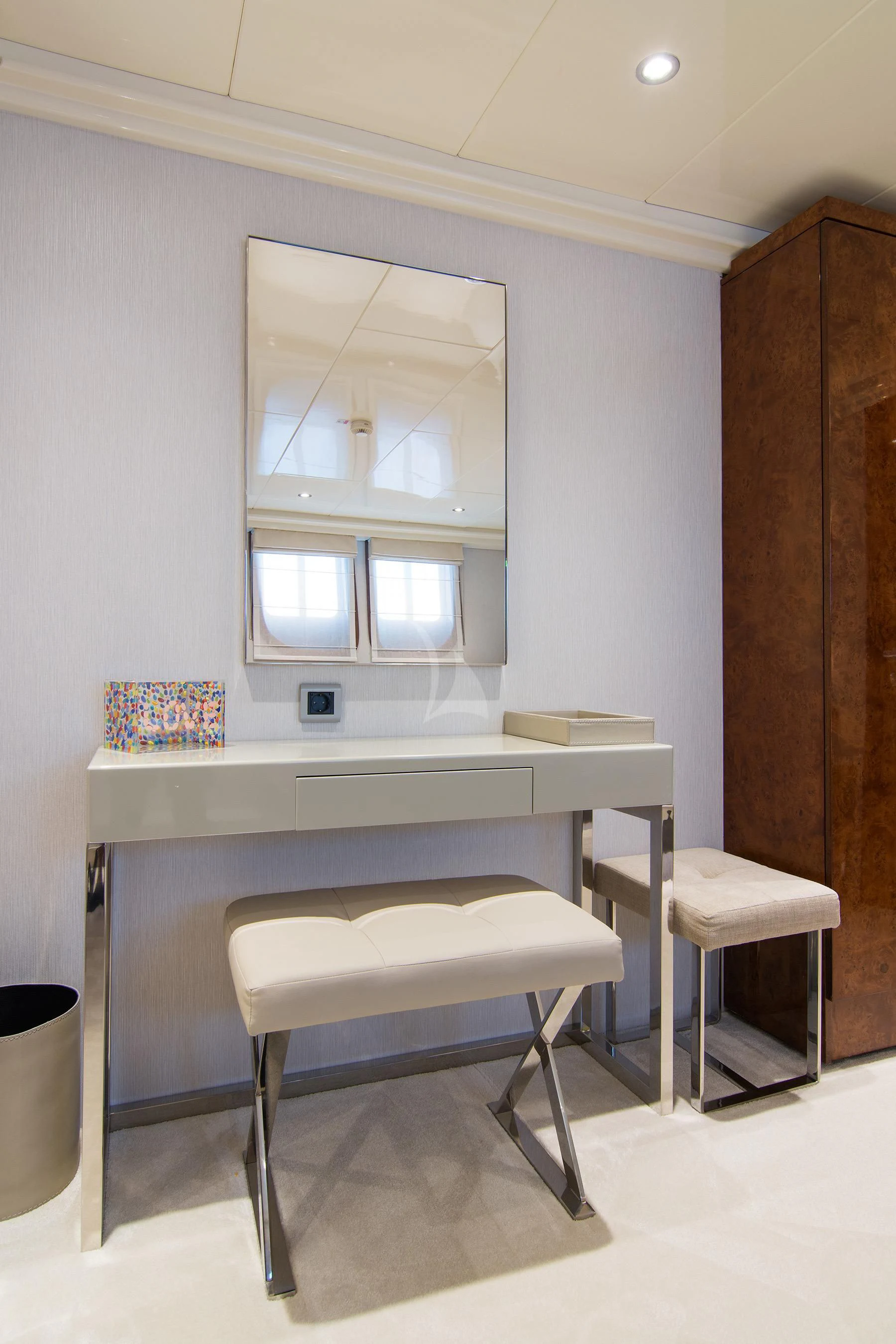 a white desk with a chair aboard HALLO Yacht for Sale