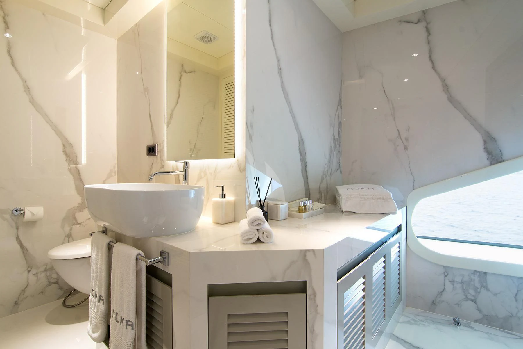 a bathroom with a sink and a toilet aboard HALLO Yacht for Sale