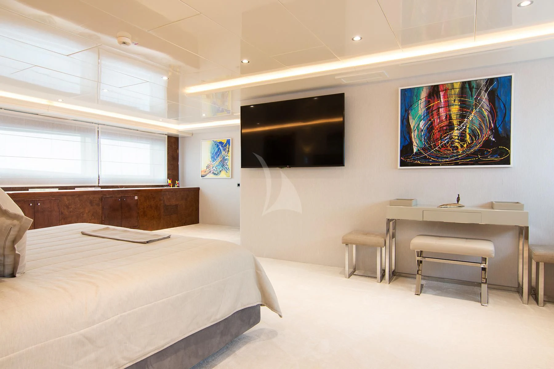 a room with a bed and a desk aboard HALLO Yacht for Sale