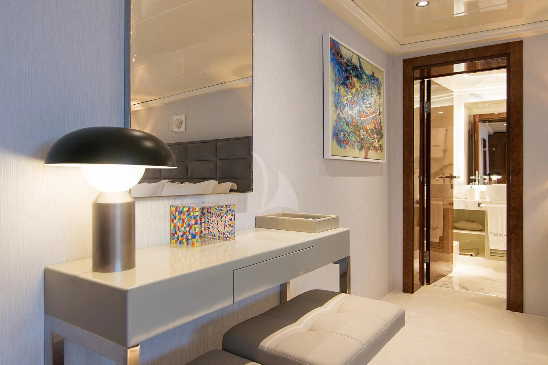 a room with a desk and a lamp aboard HALLO Yacht for Sale