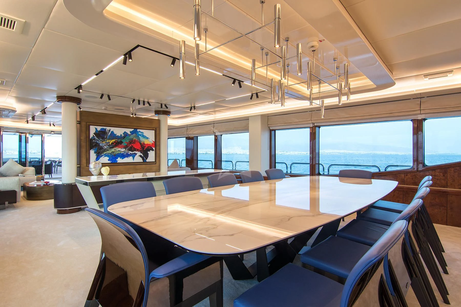 a conference room with a table and chairs aboard HALLO Yacht for Sale