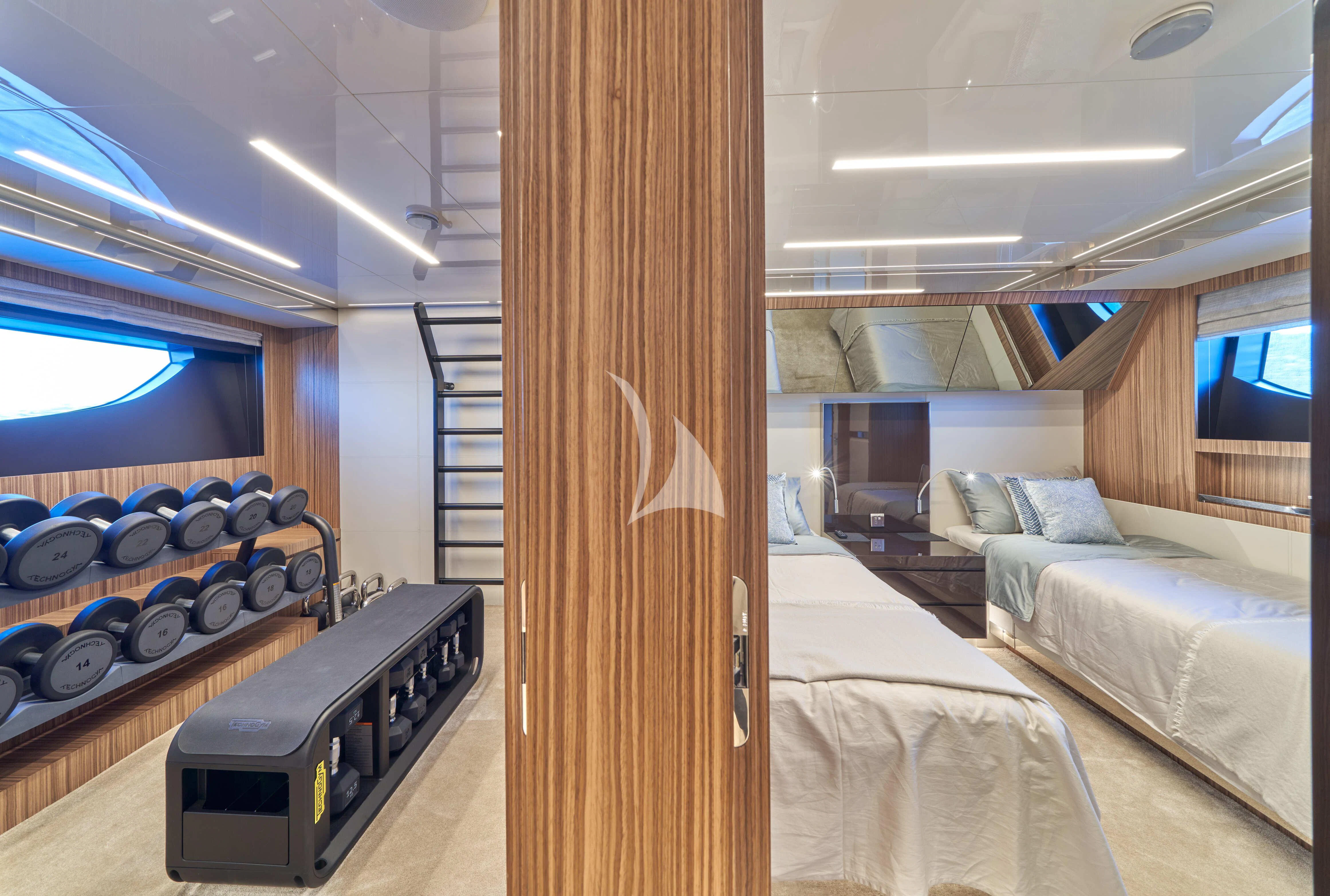 a room with a bed and a desk aboard NIKITA Yacht for Sale