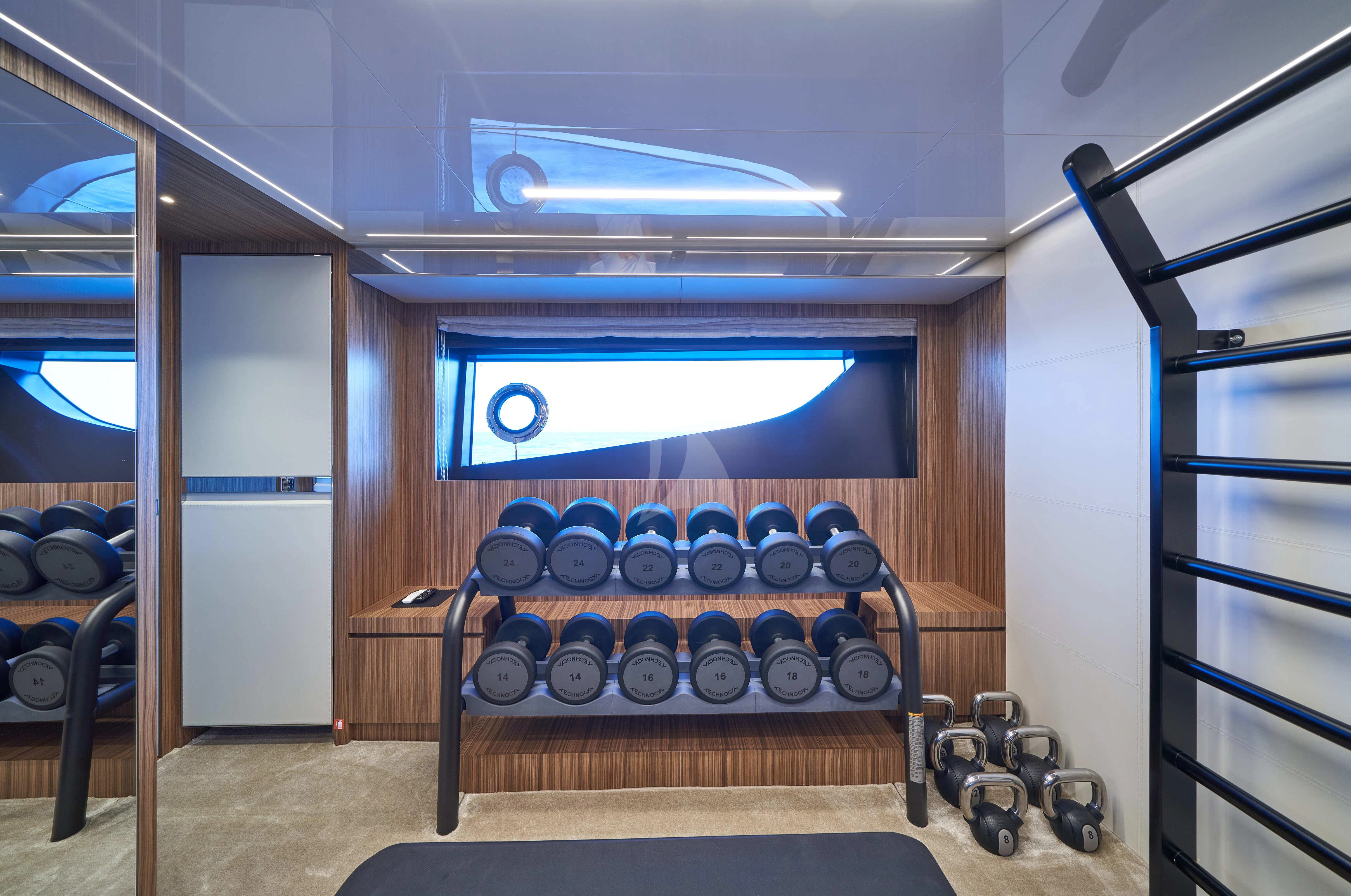 a room with a bed and a window aboard NIKITA Yacht for Sale