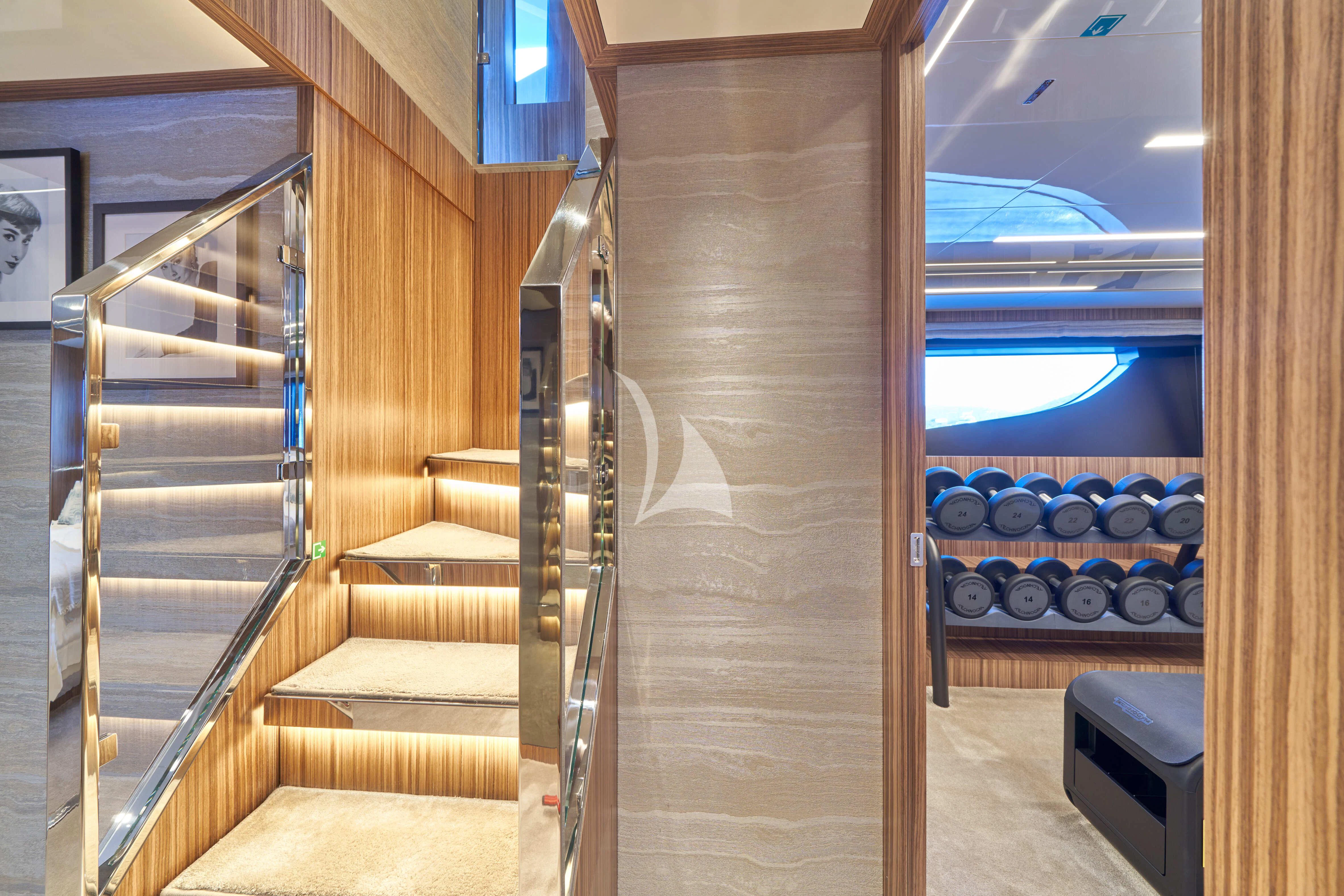 a room with a wood door and a window with a view of the ocean aboard NIKITA Yacht for Sale